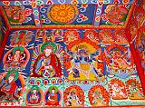 Manaslu 06 08 Syala Kani Painting The paintings on Syalas kani wall include a 4-armed Avalokiteshvara on the left, then Padmasambhava, a six-armed Mahakala, and red Hayagriva on the right.